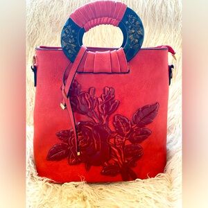 Red leather bag with roses